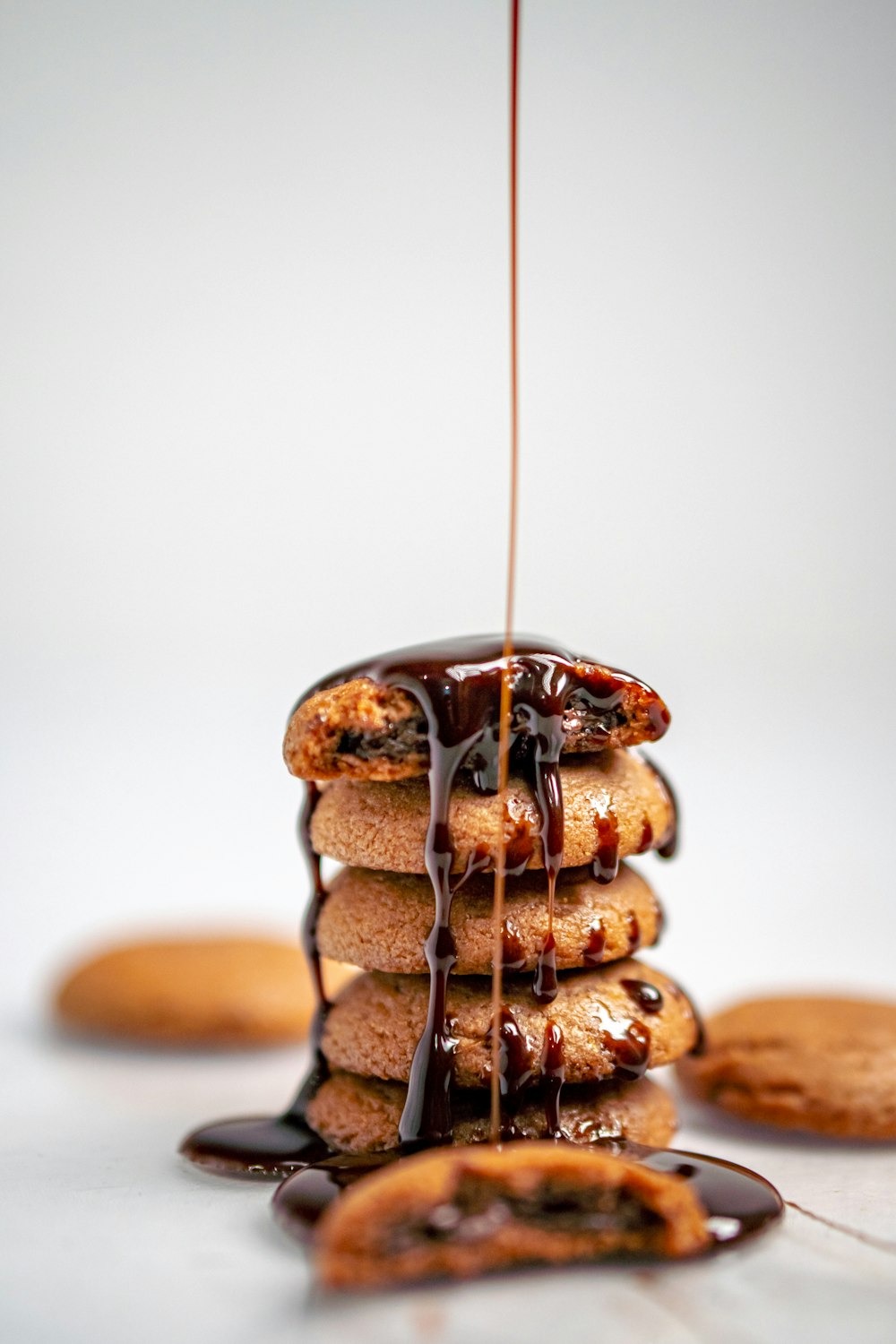 a stack of cookies drizzled with chocolate