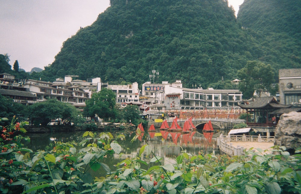 a scenic view of a city with mountains in the background