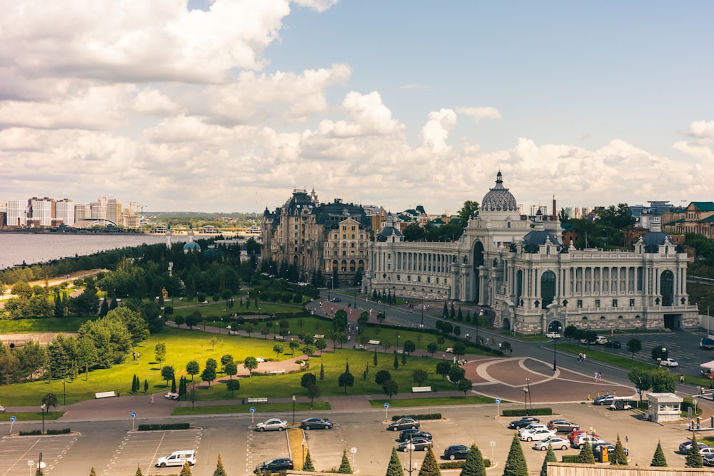 a view of a large building with a lot of cars parked in front of it