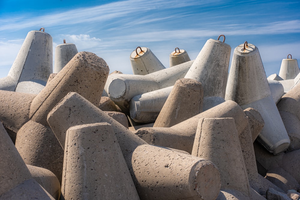 a group of cement bells sitting on top of each other