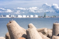 a large body of water with a city in the background