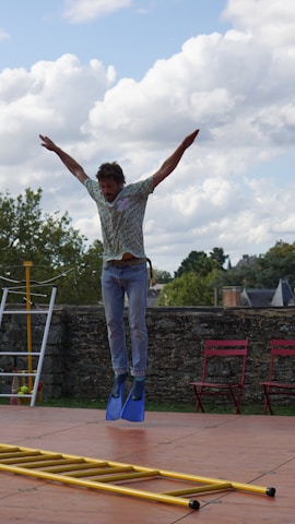 A whimsical character jumping through lively platforming levels.