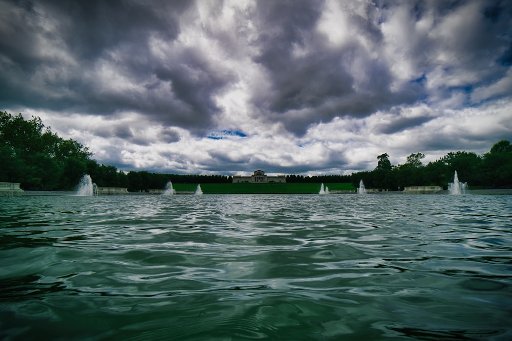 a large body of water surrounded by trees