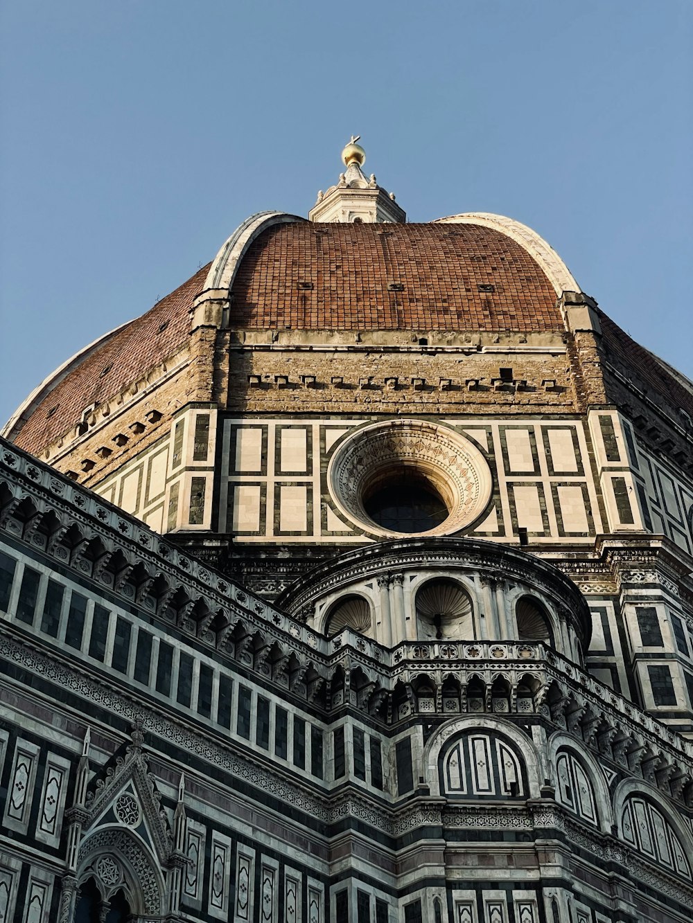 the top of a building with a clock on it