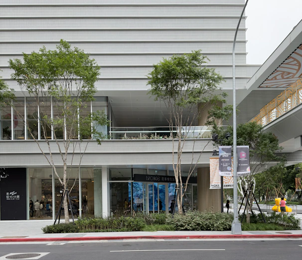 Exterior of a commercial building enhanced with fresh paint and new windows.