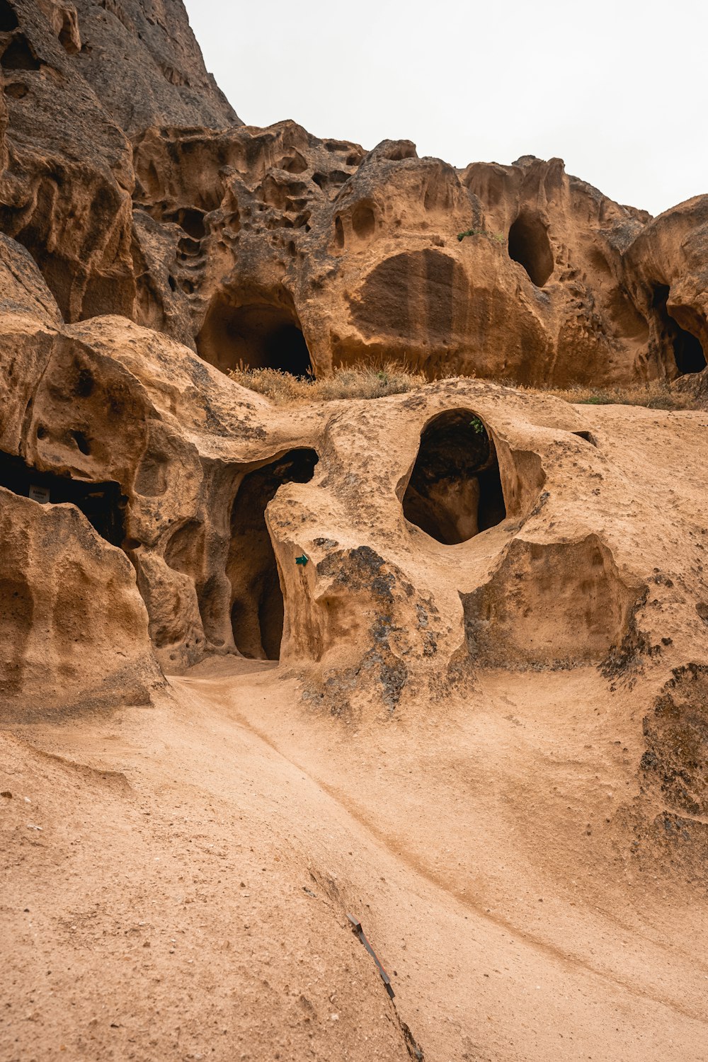 a group of rocks with holes in them