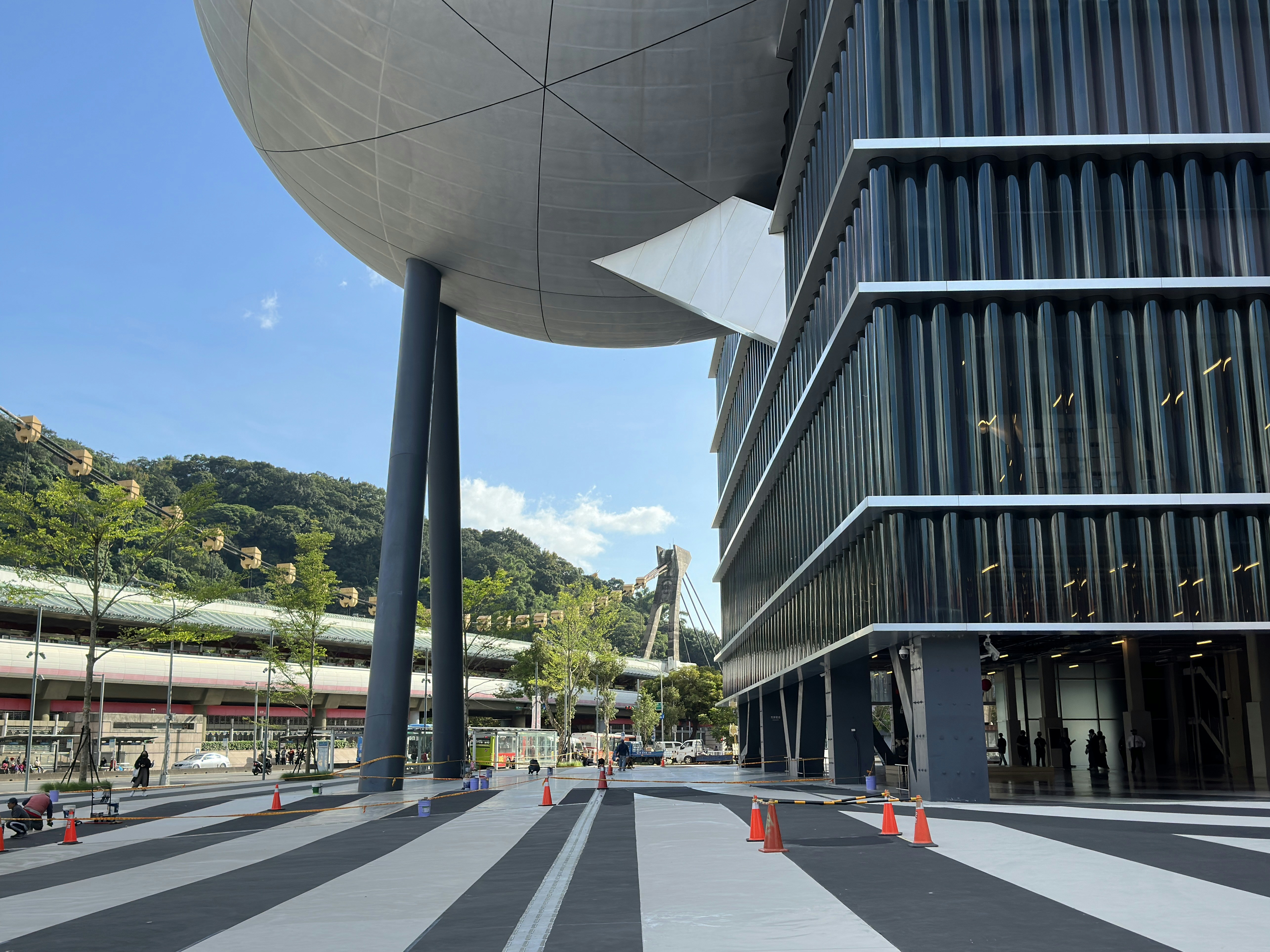 a large building with a giant ball on top of it