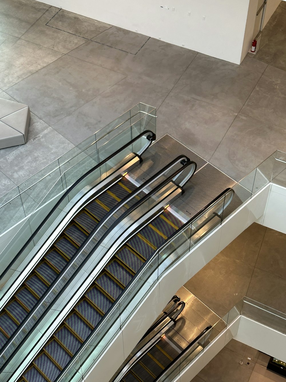 an escalator in a building with two escalators