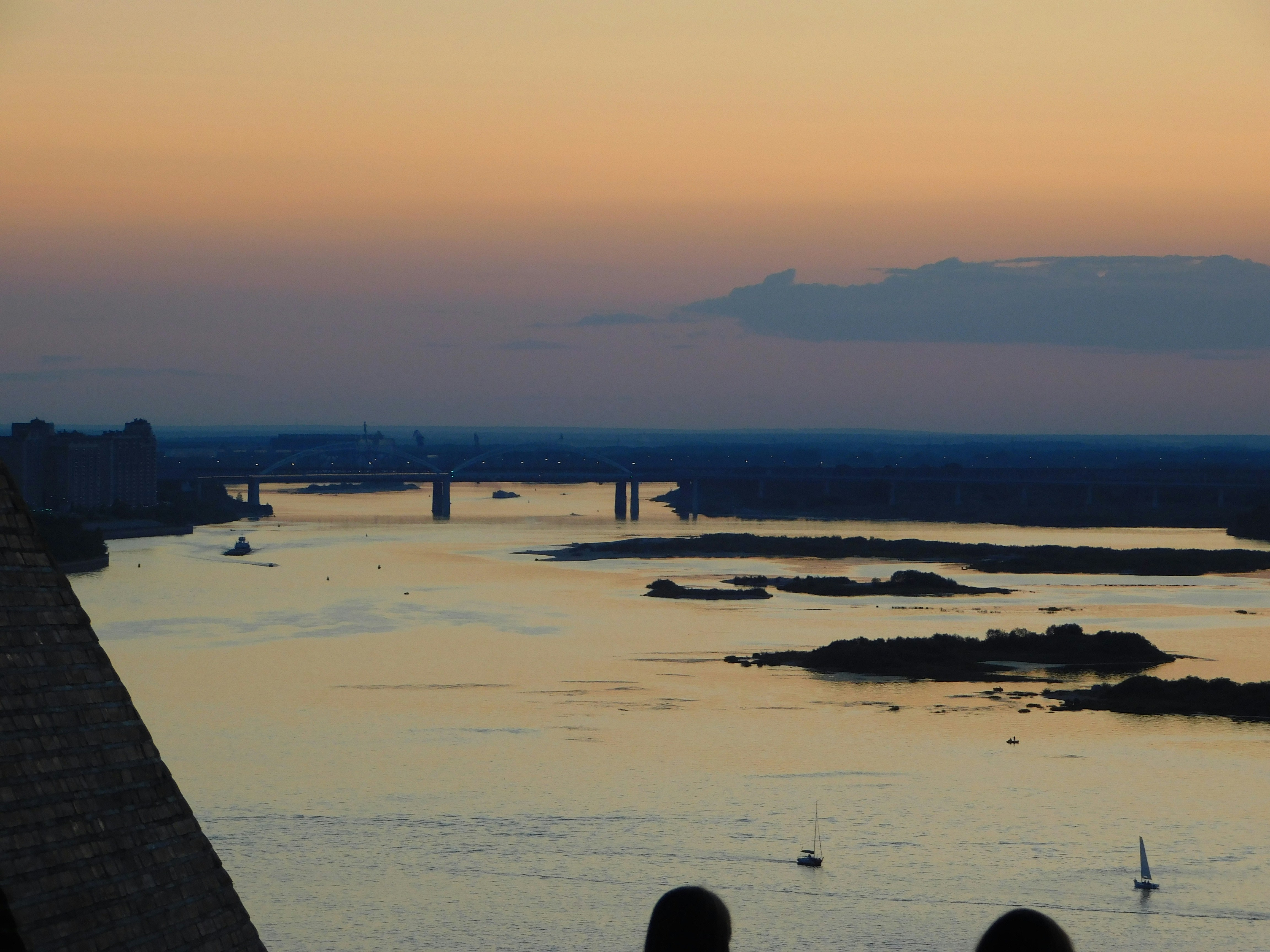 a view of a body of water with a bridge in the background