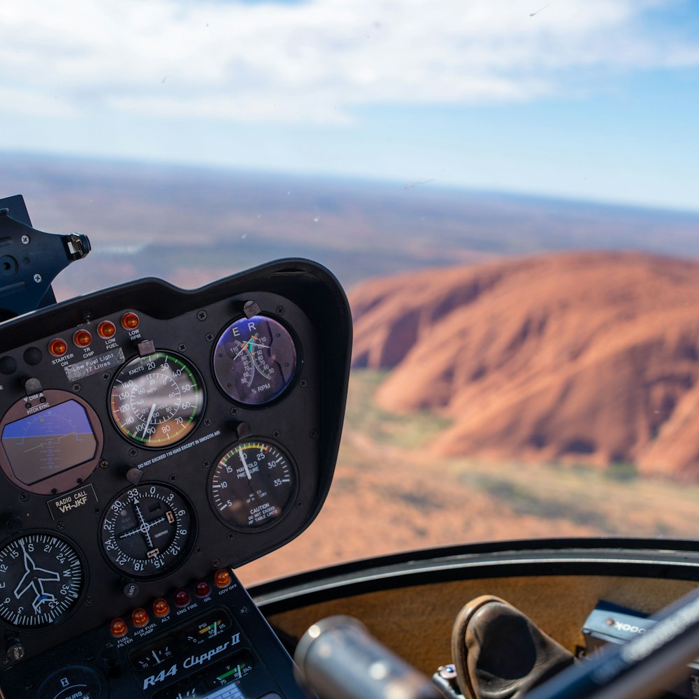 a view of a mountain from inside a plane