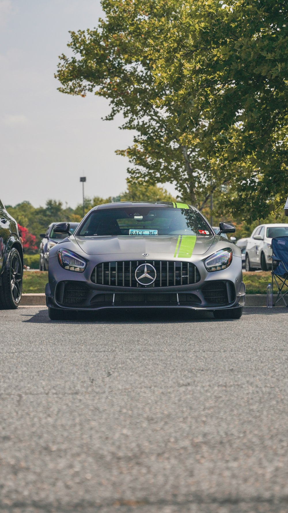 a mercedes sports car parked in a parking lot