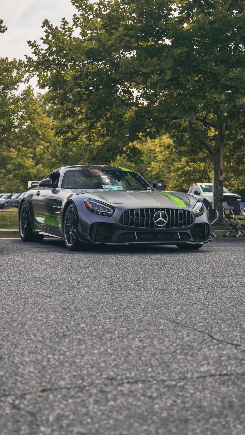 a mercedes sports car parked on the side of the road