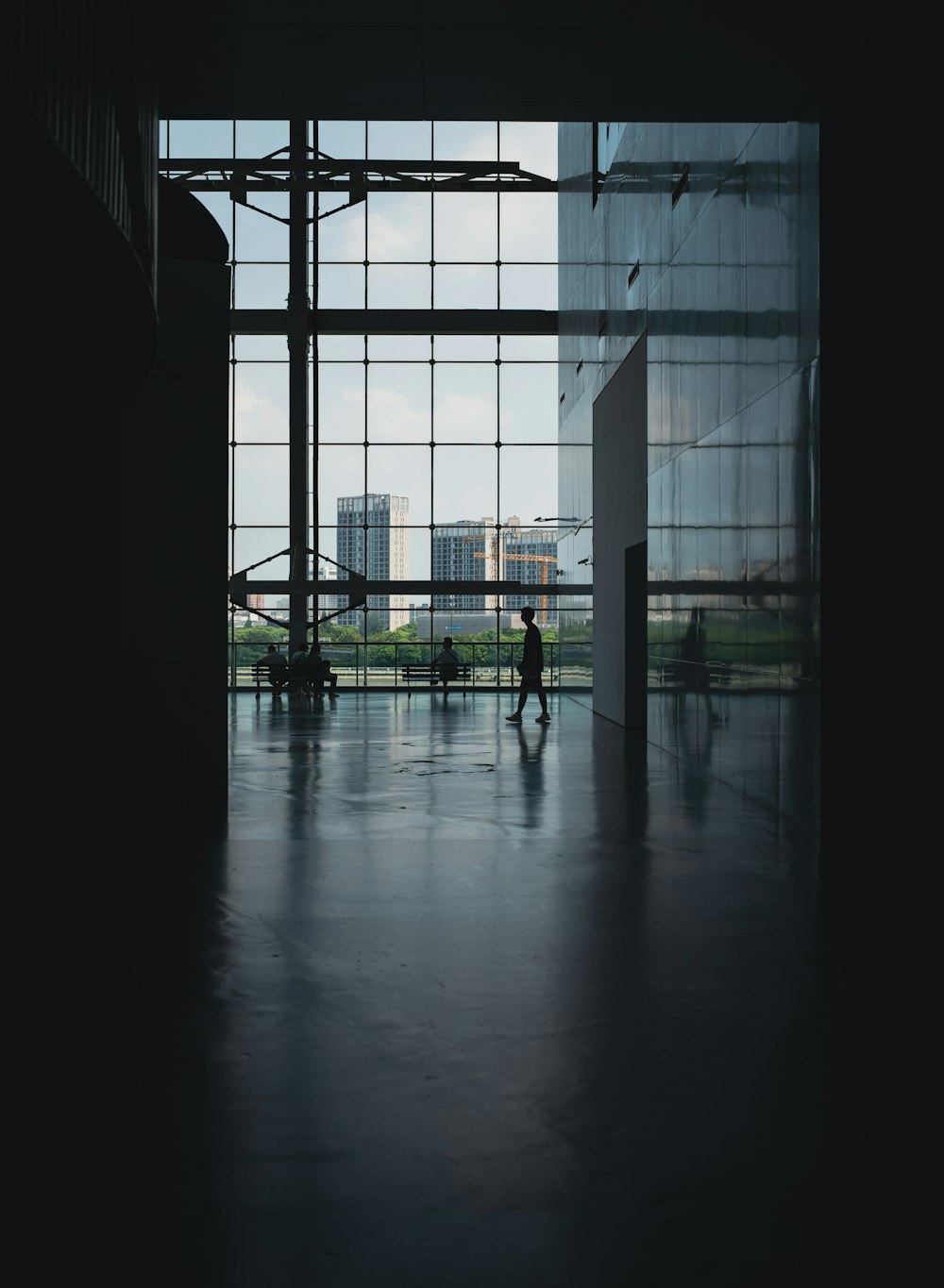 a couple of people standing in front of a window