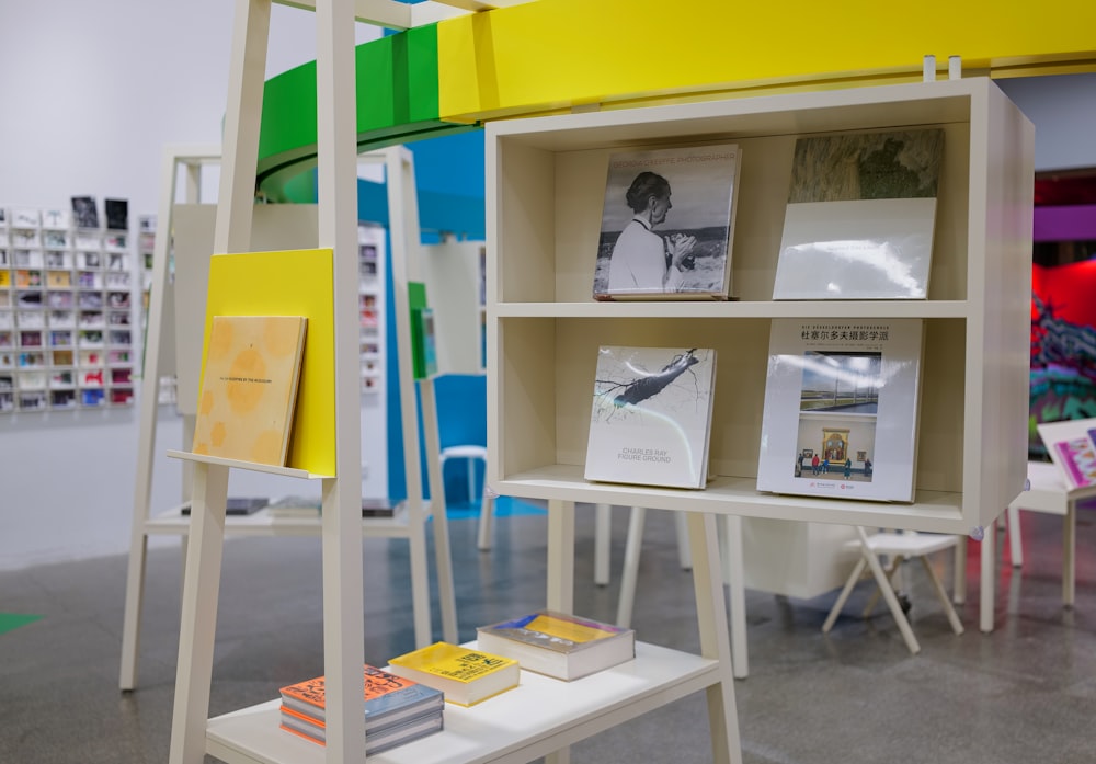 a book shelf with books on it in a room