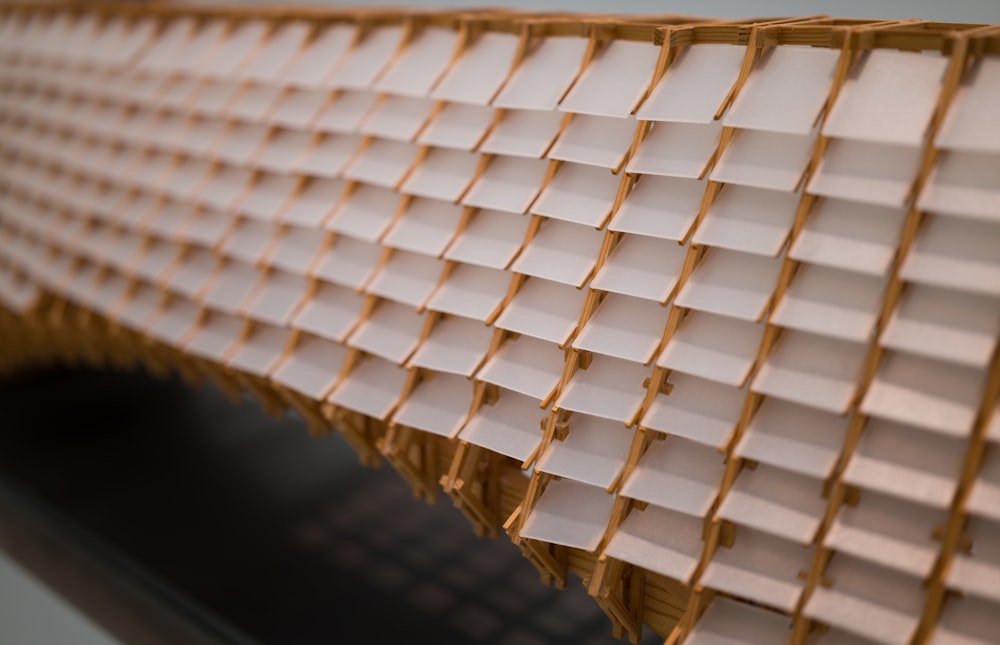 a close up of a wall made out of stacks of papers