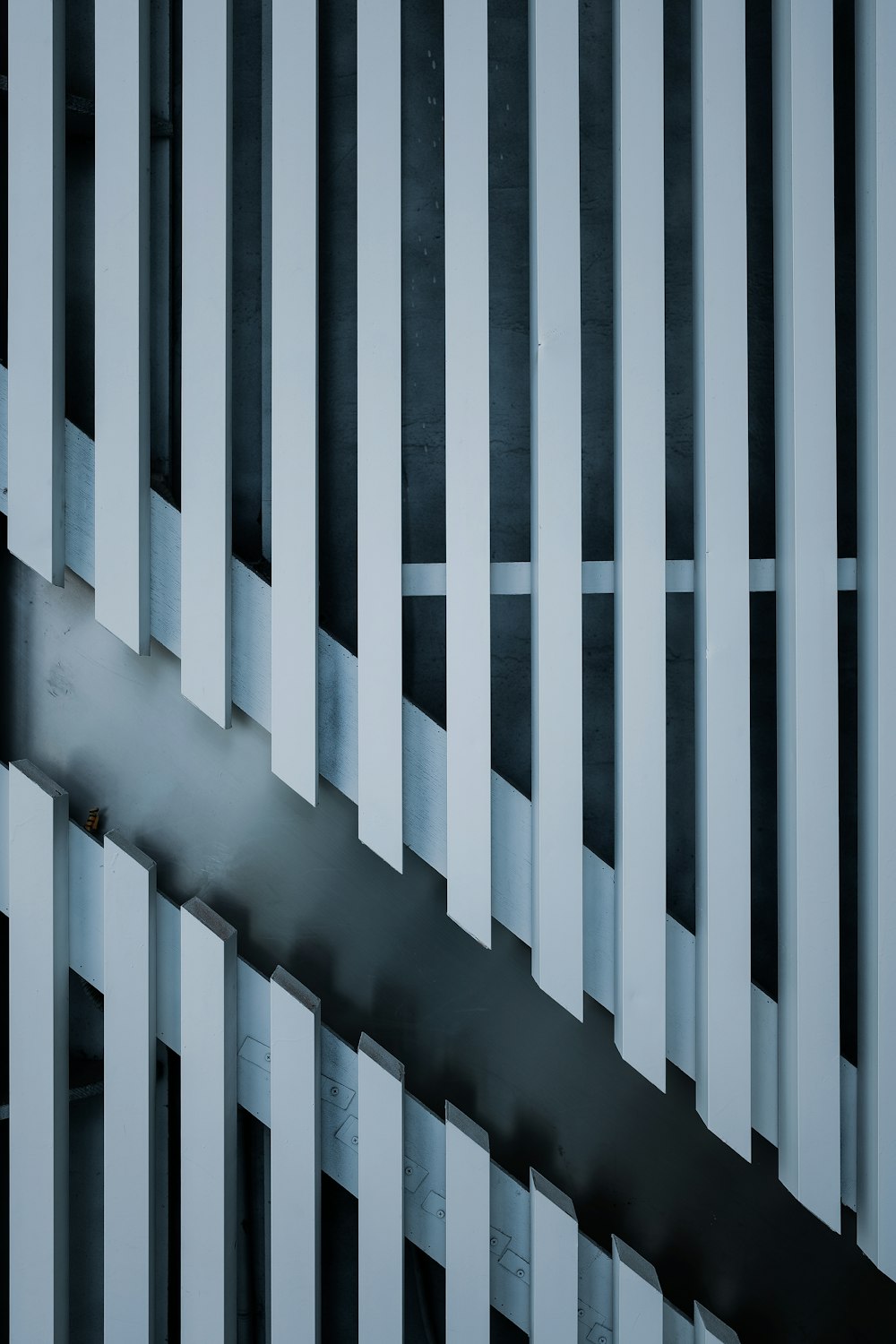 a black and white photo of smoke coming out of a window