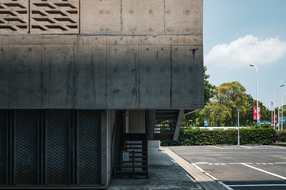 an empty parking lot next to a building