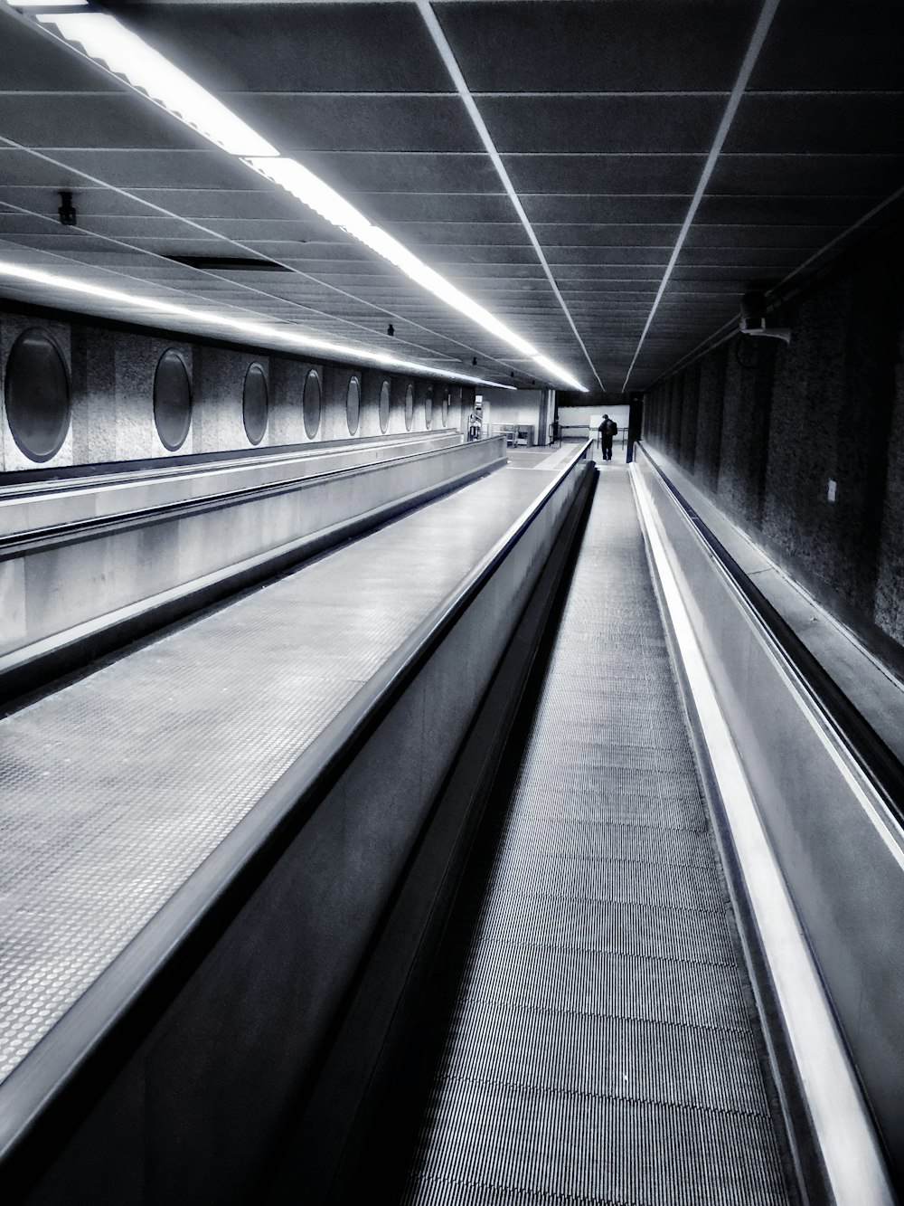 a black and white photo of an empty subway