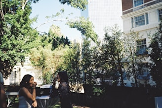 A scenic outdoor setting with two guests enjoying a conversation.