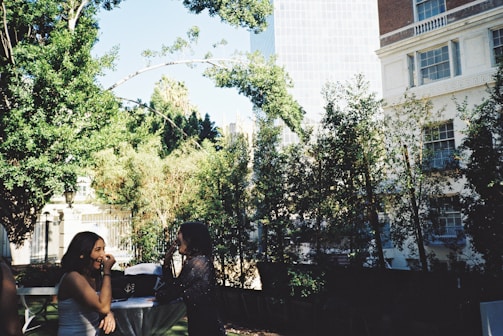 A scenic outdoor setting with two guests enjoying a conversation.