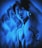 Multiple overlayed images of a shirtless person with a tattoo of flowers on the shoulder. The person wears a necklace and has a calm or introspective expression. The artwork is heavily saturated in blue tones, giving it a surreal and dreamy effect.