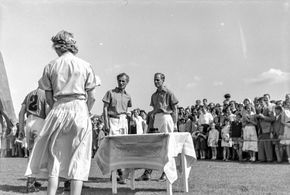 a black and white photo of a group of people