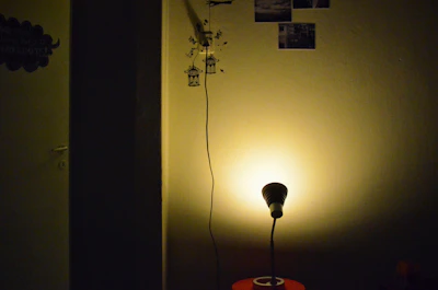 A beautifully decorated room showcasing a custom wall sticker glowing under soft lighting.