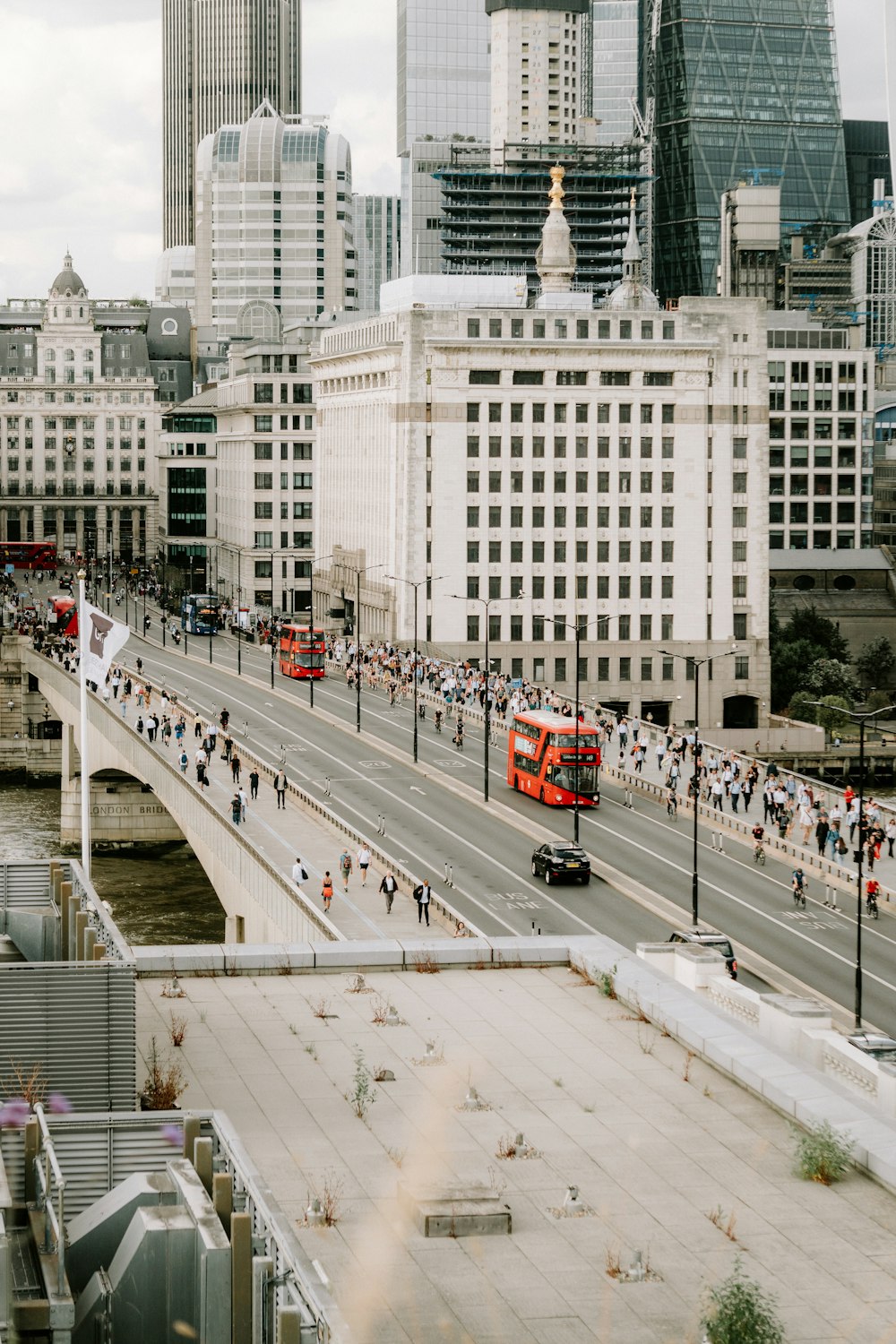 a view of a busy city street with a red double decker bus