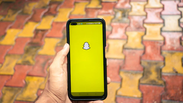 A vibrant smartphone screen showing a lively Snapchat chat interface.