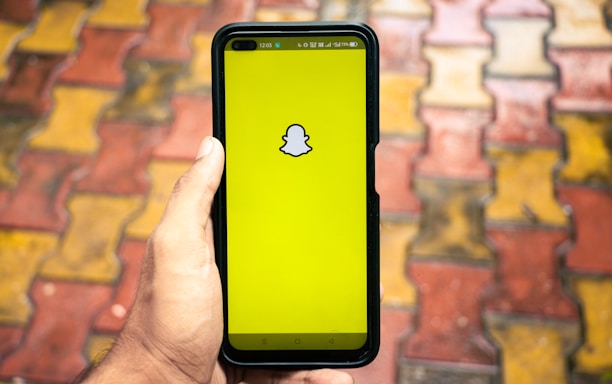 A vibrant Snapchat ad displayed on a smartphone screen with engaging visuals.