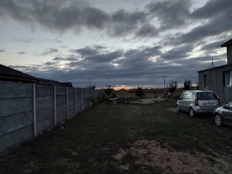 Spacious backyard with solar-powered garden lights at dusk.