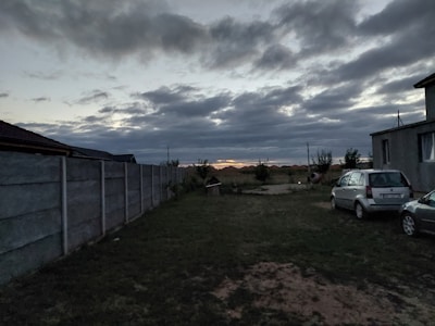 Spacious backyard with solar-powered garden lights at dusk.