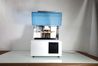 Side view of Hixsop A3 printer highlighting its sleek design and technology blue accents.