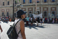 Community members gathered outdoors for a guided historic walking tour along South Flower Street.