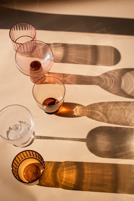 a number of wine glasses on a table