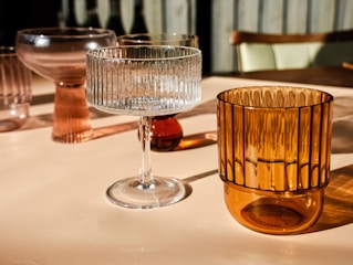 a close up of a glass on a table