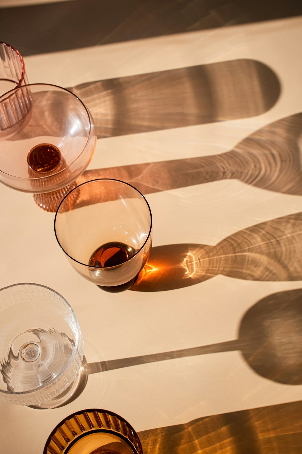 a table topped with three glasses of wine