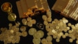 lots of gold coins and gold bullion showing how gold is a time tested asset