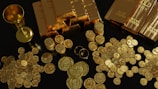 a table topped with lots of gold coins