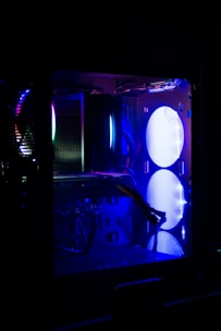 Vibrant orange neon-lit hardware components glowing in a black case.