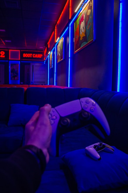 Cozy PlayStation 4 area with comfortable seating and ambient neon lighting