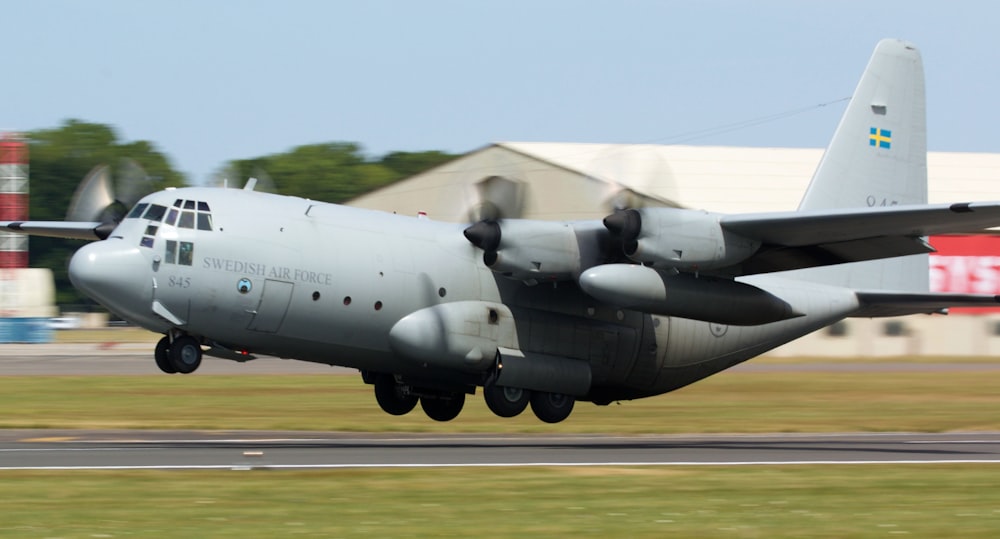 a large air plane taking off from an airport runway