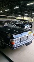 Classic vintage cars displayed at the GD Car Museum, shining under soft indoor lighting.