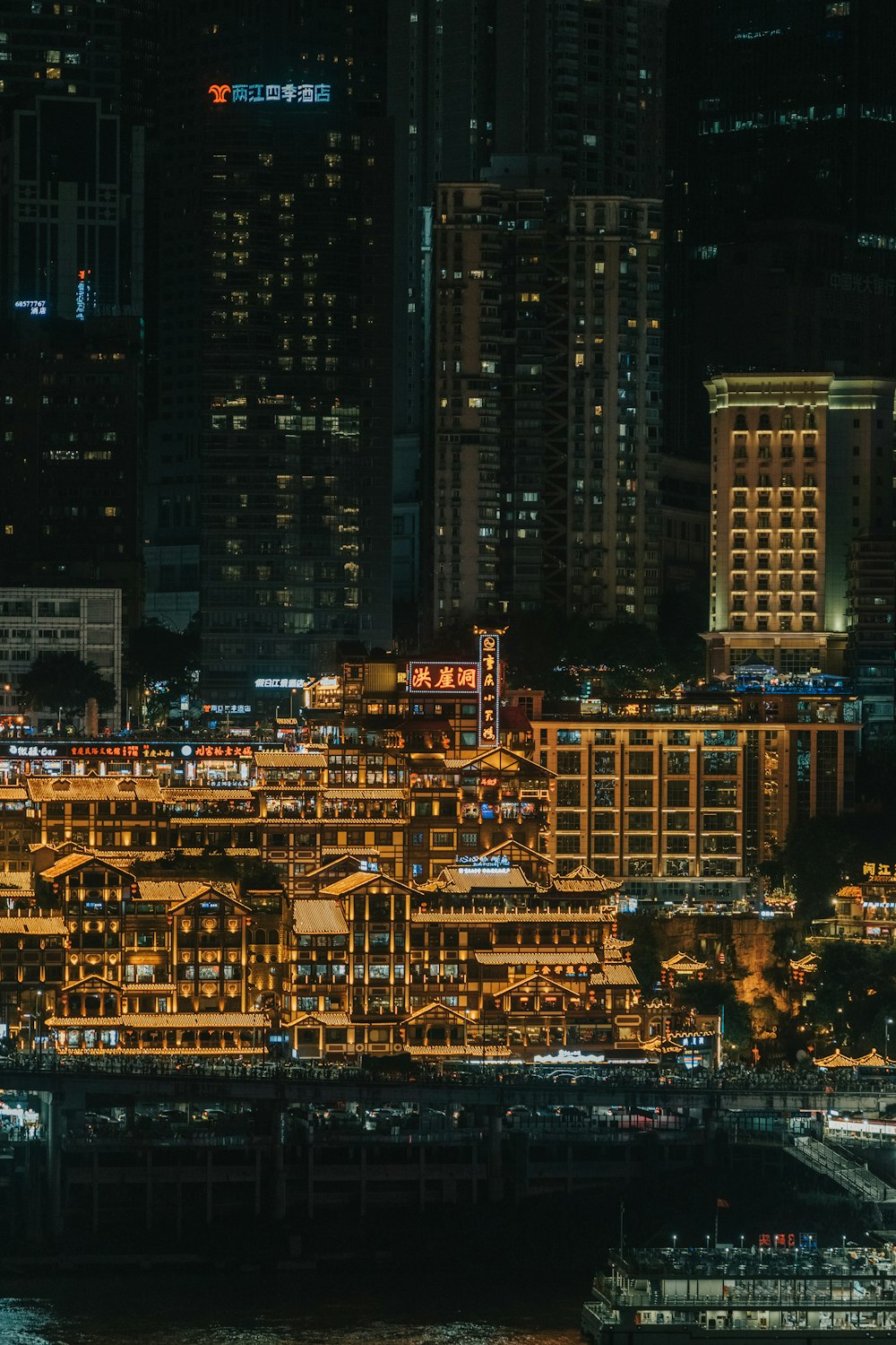 a city at night with lots of tall buildings