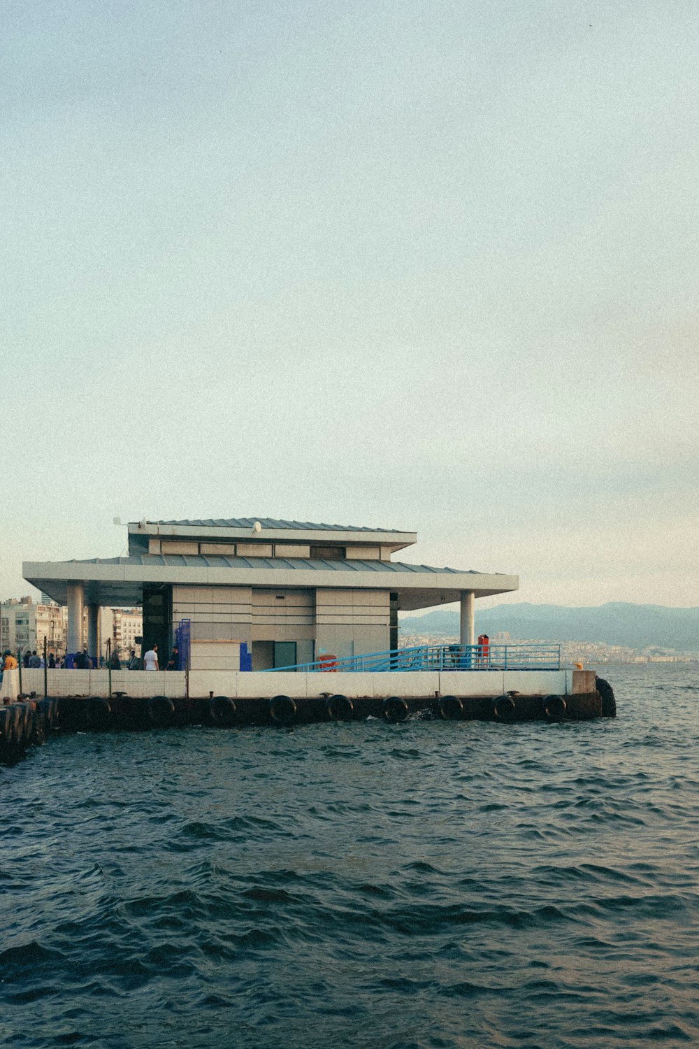 a building sitting on top of a body of water