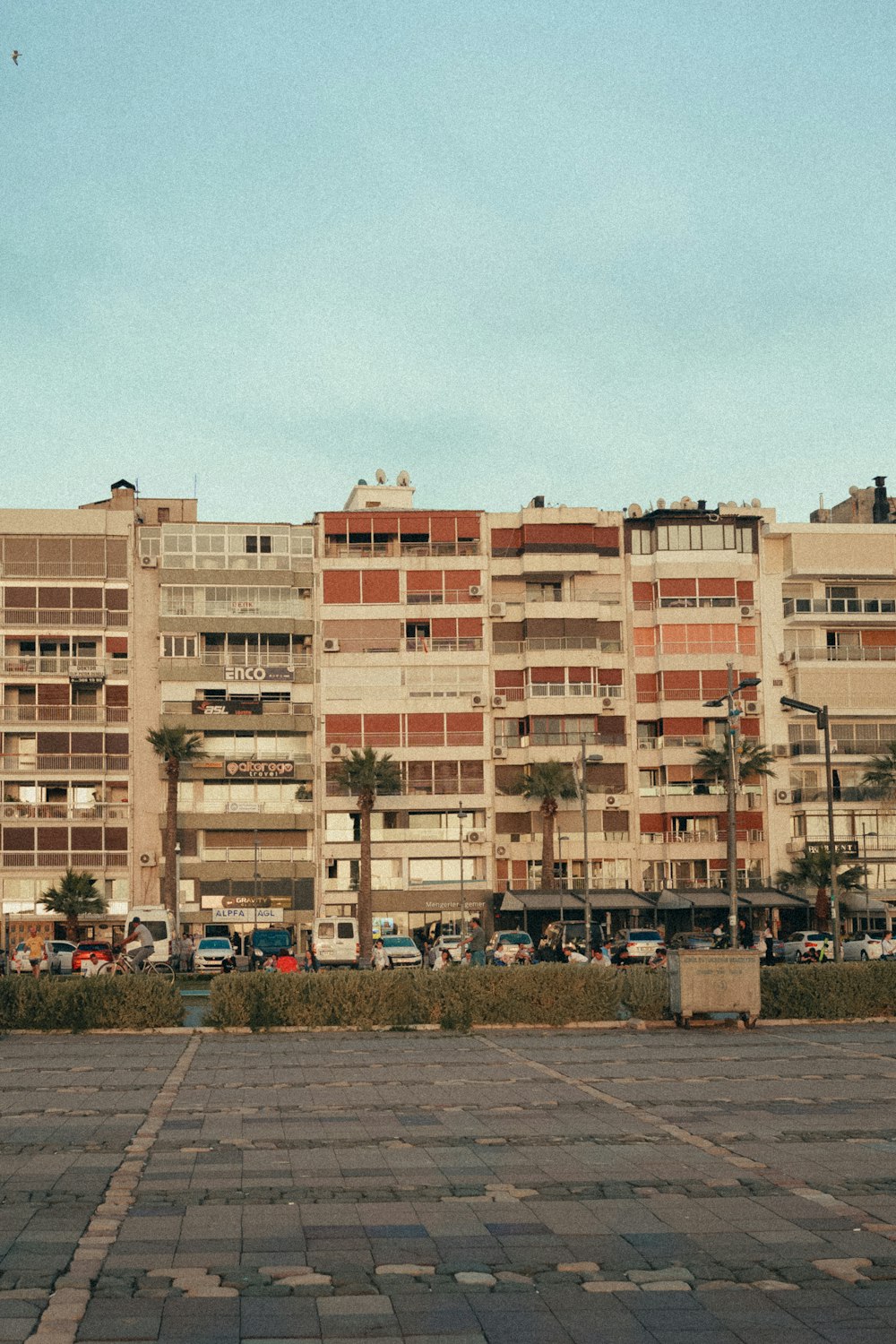 a tall building sitting next to a parking lot