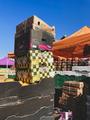 Stacks of packaged goods ready for delivery with the markethub logo visible on boxes.