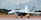 a fighter jet sitting on top of an airport runway