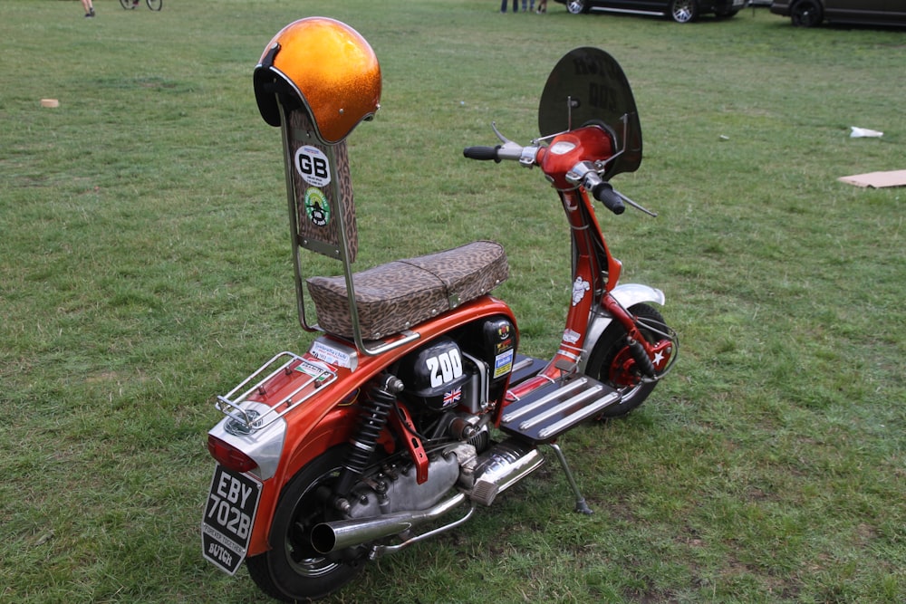 a scooter with a helmet on the back of it