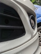Before and after image of a car bumper showing dent removal.